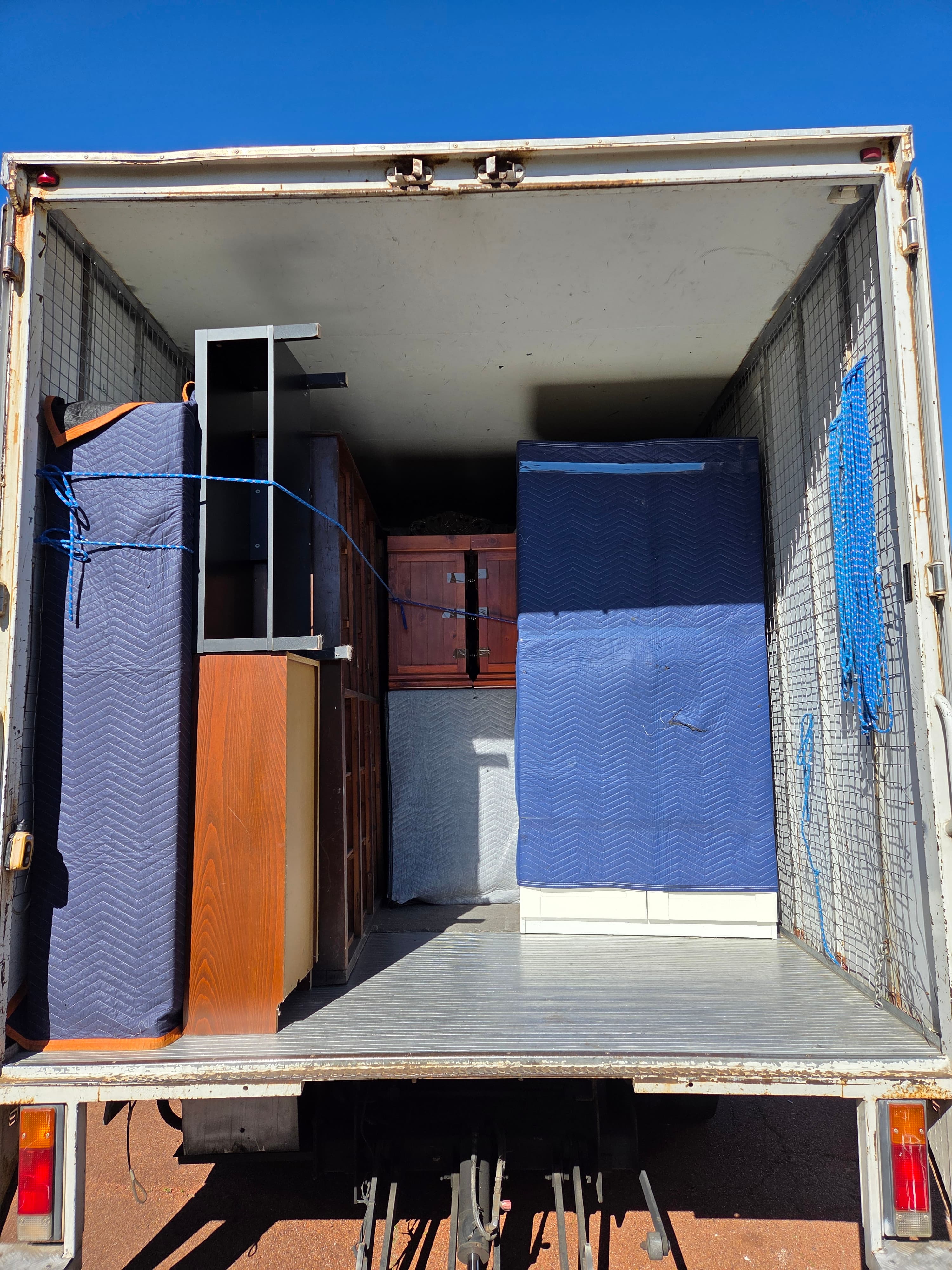 Awesome Mate Removals crew loading furniture for a Perth to Sydney move
