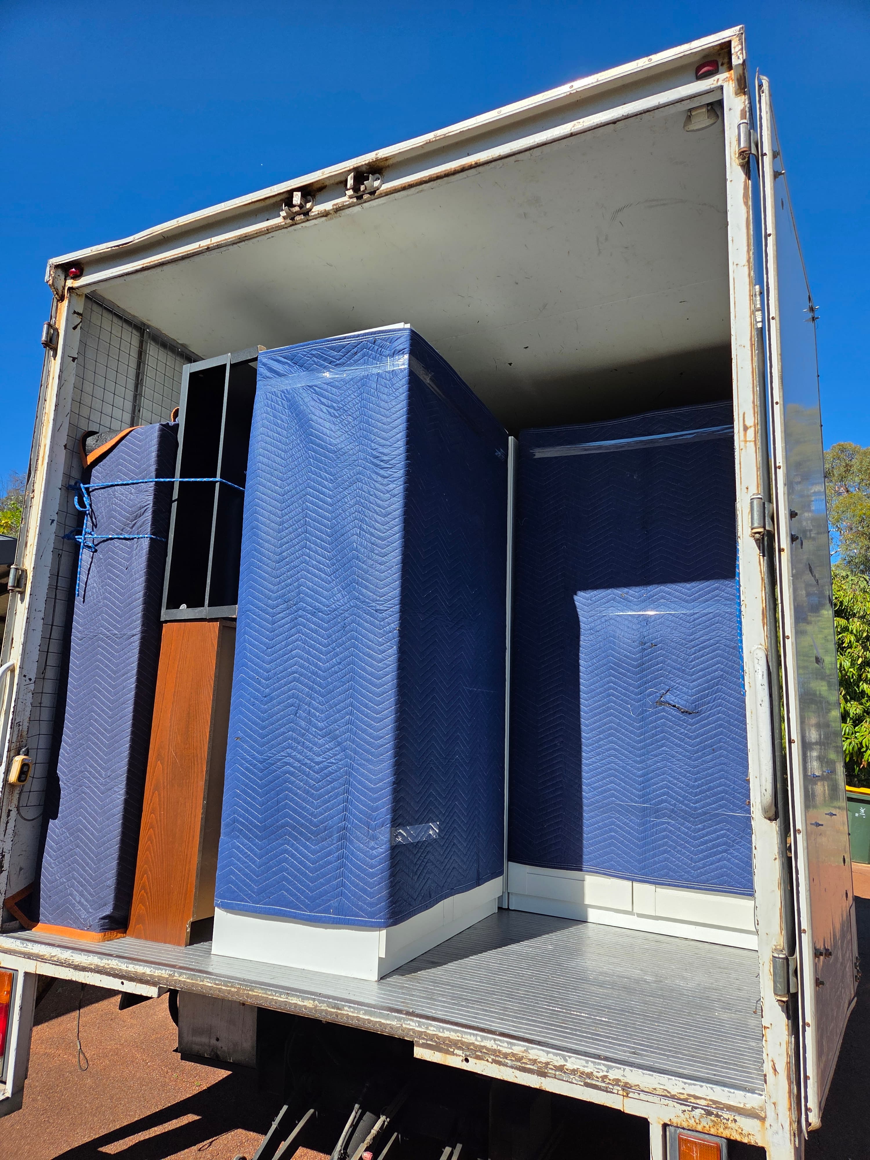 Furniture loaded onto the Awesome Mate Removals truck
