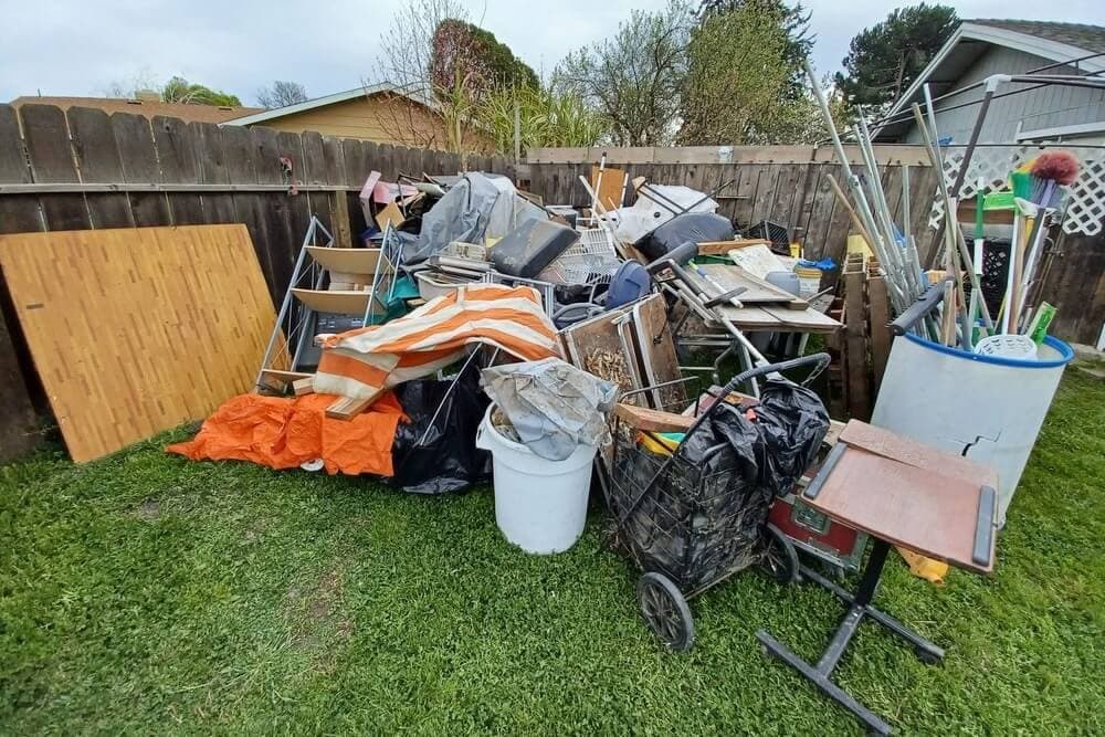 Awesome Mate Removals crew sorting junk at a Perth property before loading