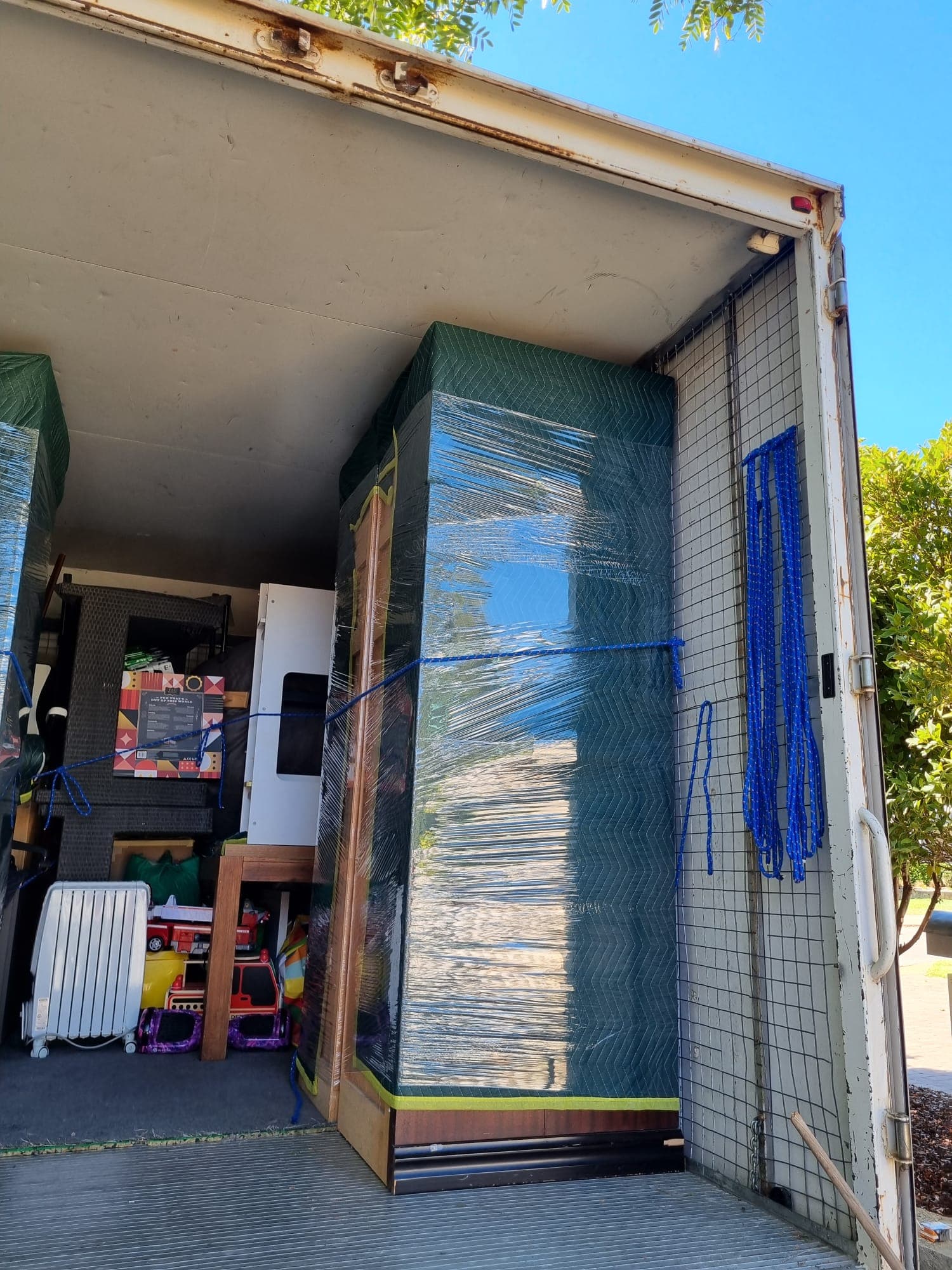 Furniture being moved by Awesome Mate Removals